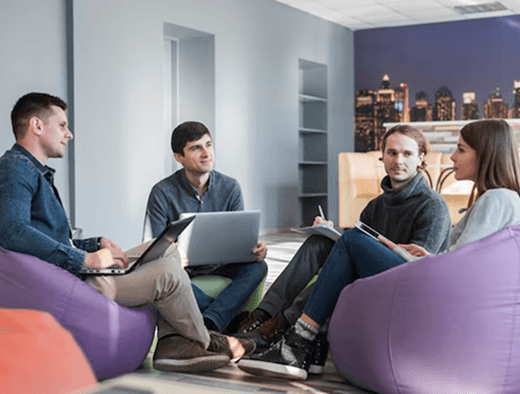 Group of people discussing tech